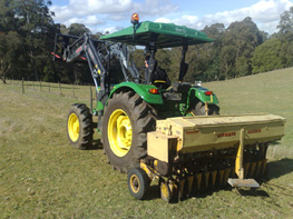Connor Shea disc seeder at work in Gembrook. Discs slice the soil open and the seeder drops in a trickle of fertilizer and seed. The next crop can be sown without disrupting the existing crop to get a smooth succession. . 